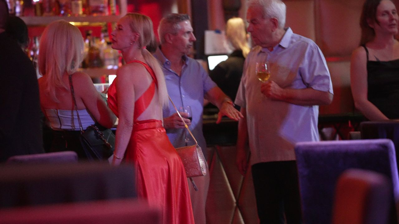 Guests mingling at the Stirling Club bar