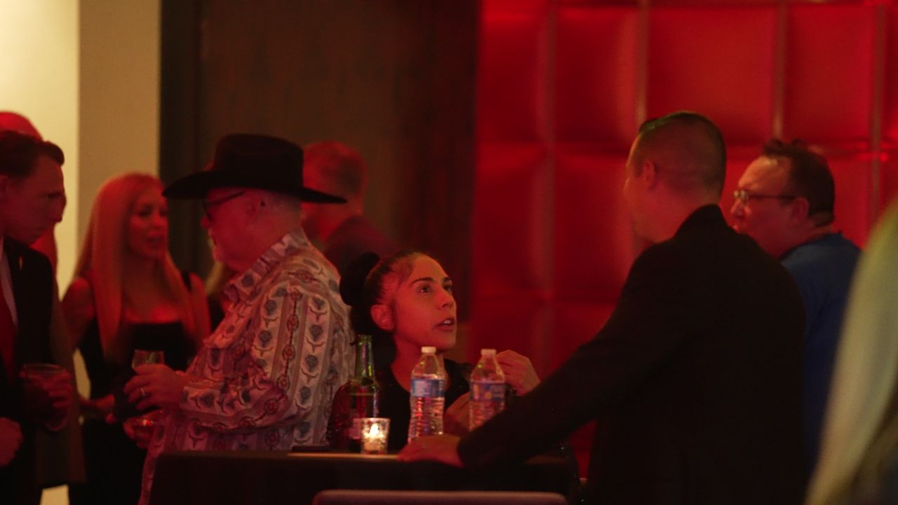 Guests seated at cocktail tables