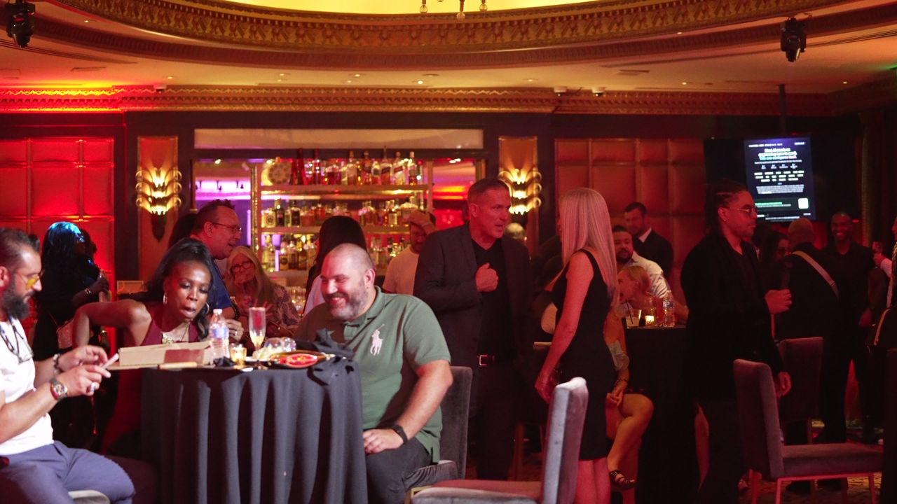 Guests at a table in the full room