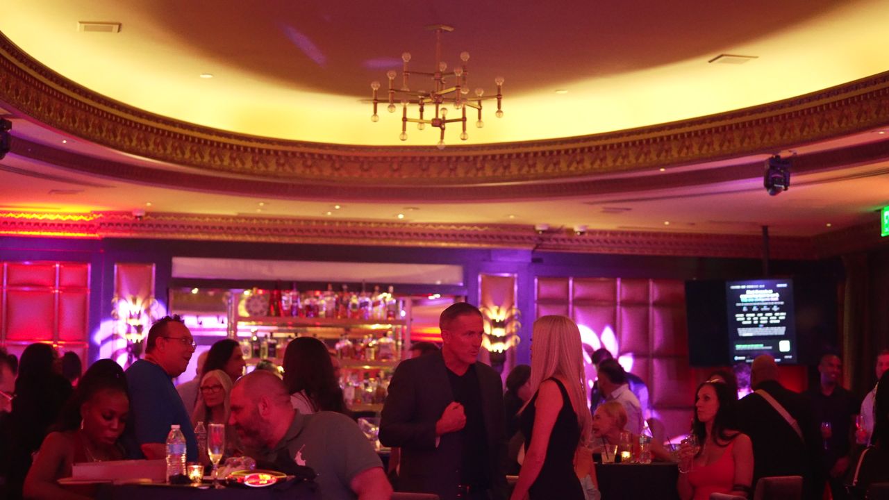 The crowd beneath the domed ceiling of the Stirling Club